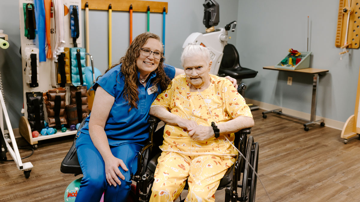 Elder with Therapist at Lake Village Rehabilitation and Care Center